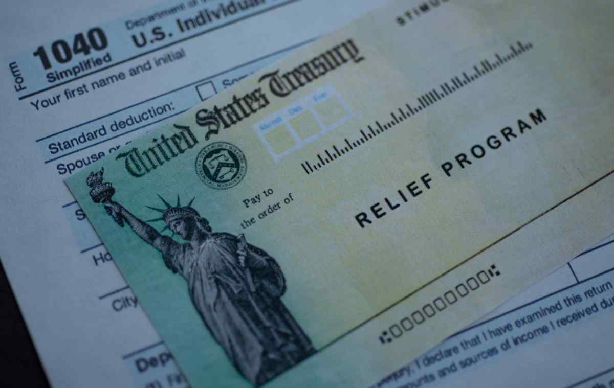 Stimulus check placed on a tax form.