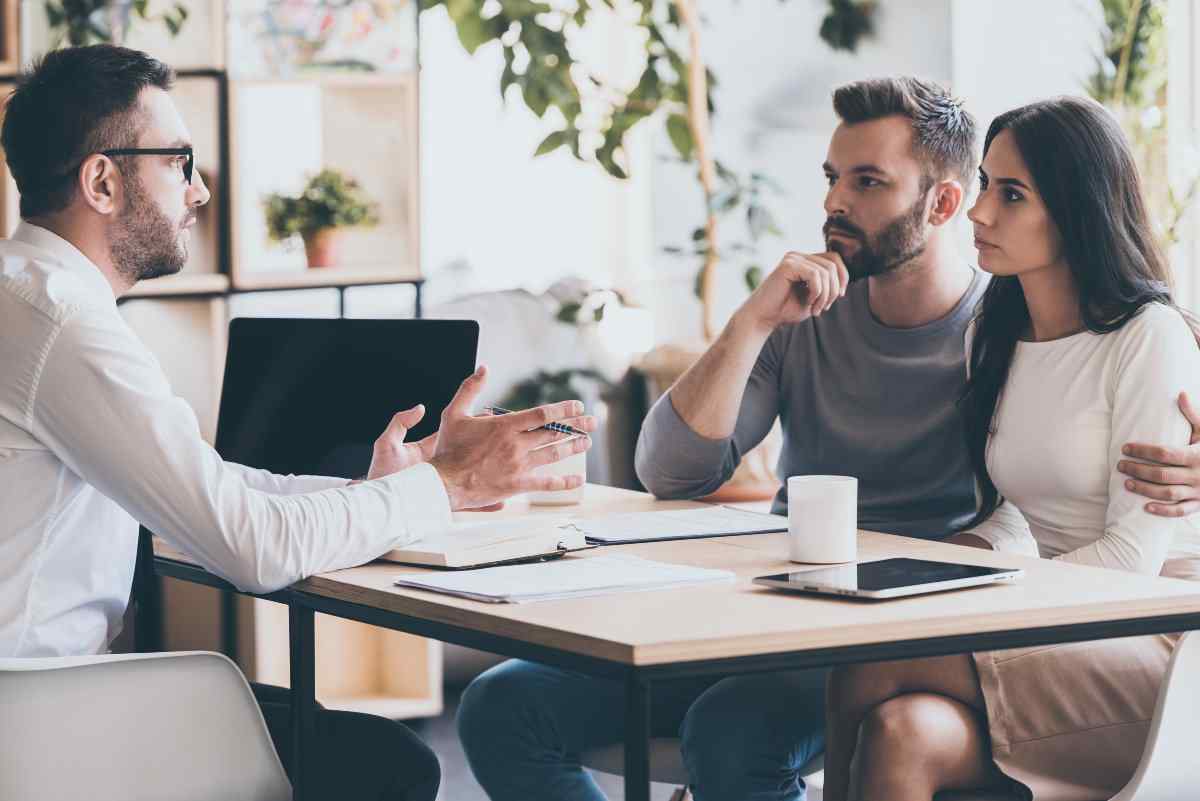 Couple meeting with financial advisor.