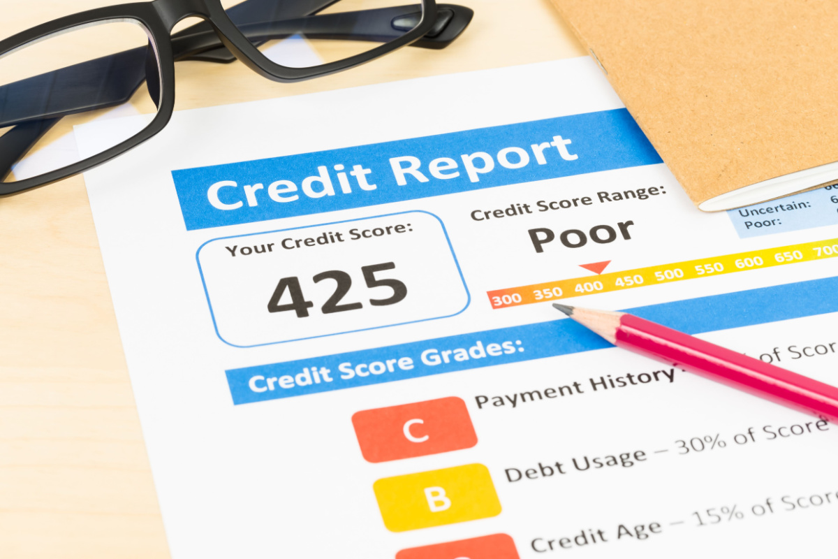 Image of a credit report paper with a bad credit score, symbolizing a common reason for loan applications being declined.