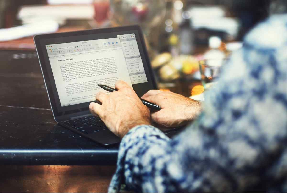 Airbnb copywriter typing on laptop