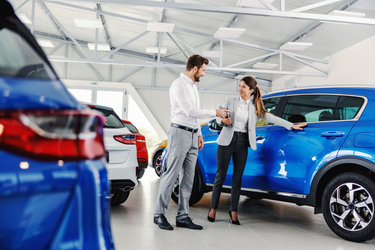 Individual shopping for cars at dealership 