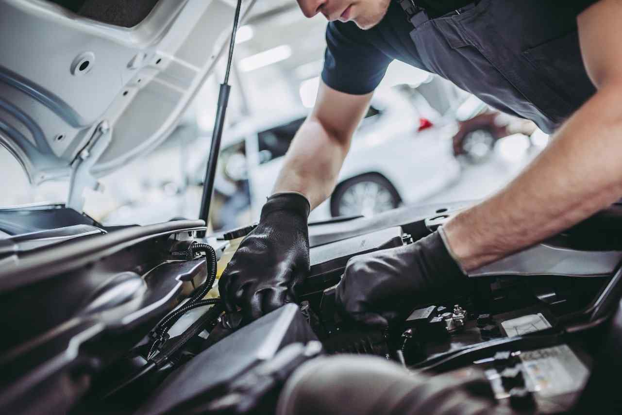 Mechanic working on car 