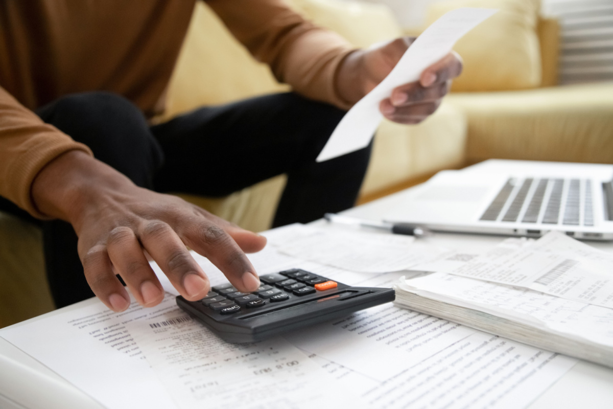 Individual calculating debt 