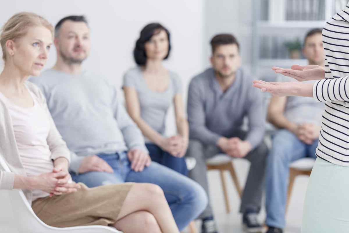 Teacher standing in front of a group.