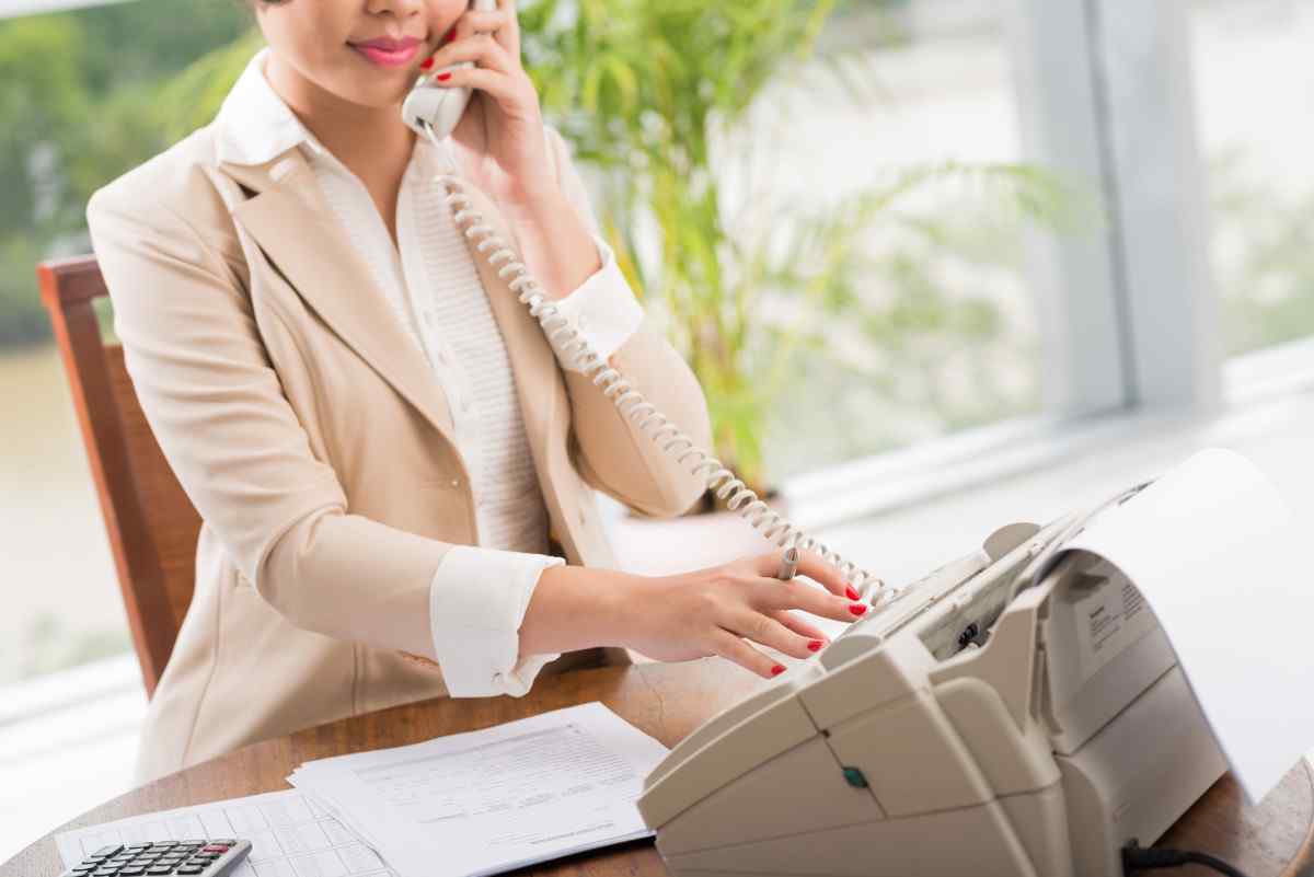 Businesswoman receiving a fax.