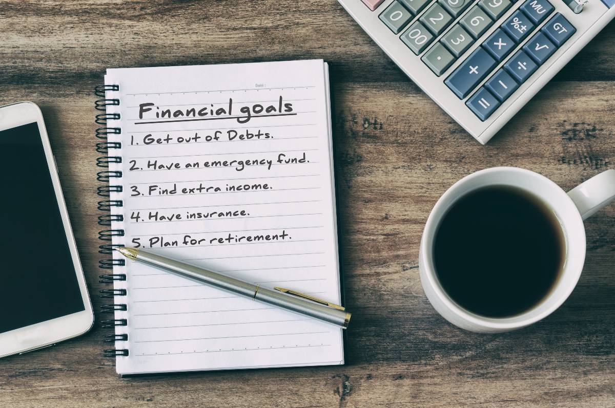 Close up on journal with a list of financial goals