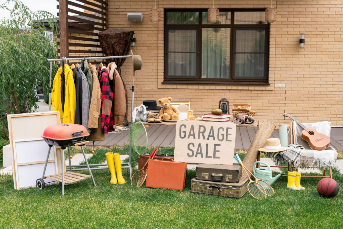 Garage sale items set up in yard