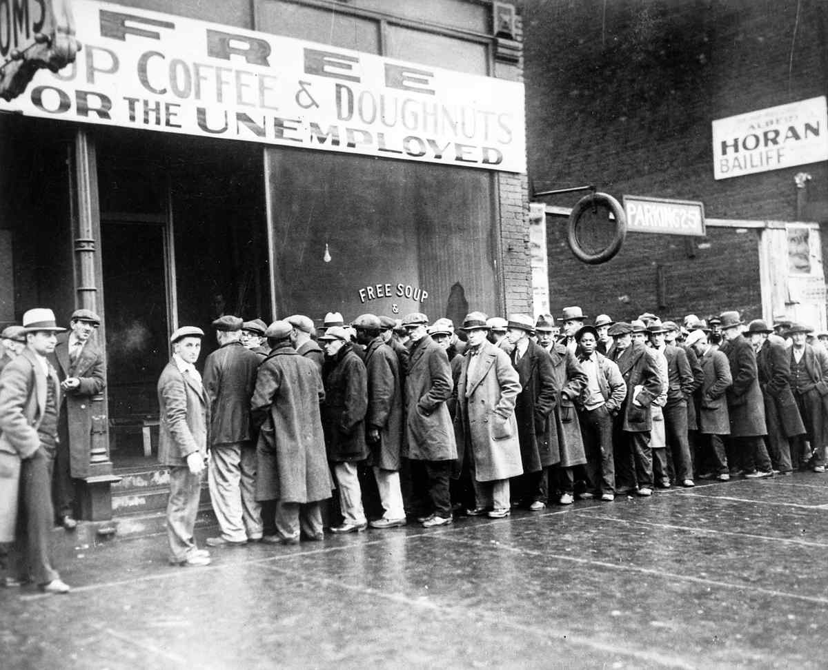 People standing in line for free food.