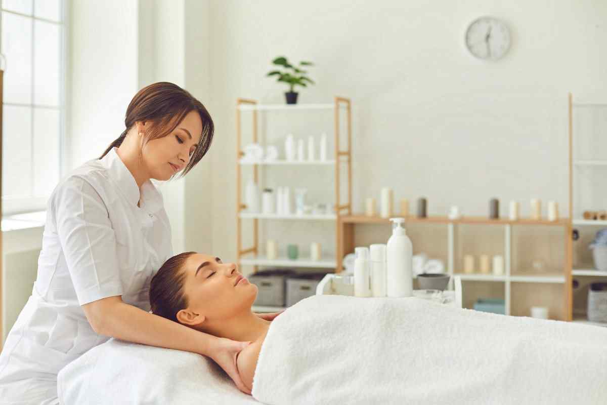 Massage therapist giving client a massage 