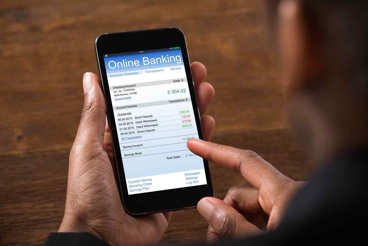 Close up of individual using mobile banking 