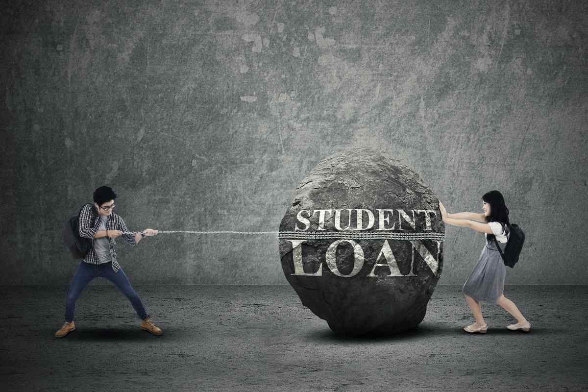 Students pushing and pulling a giant rock symbolizing debt.