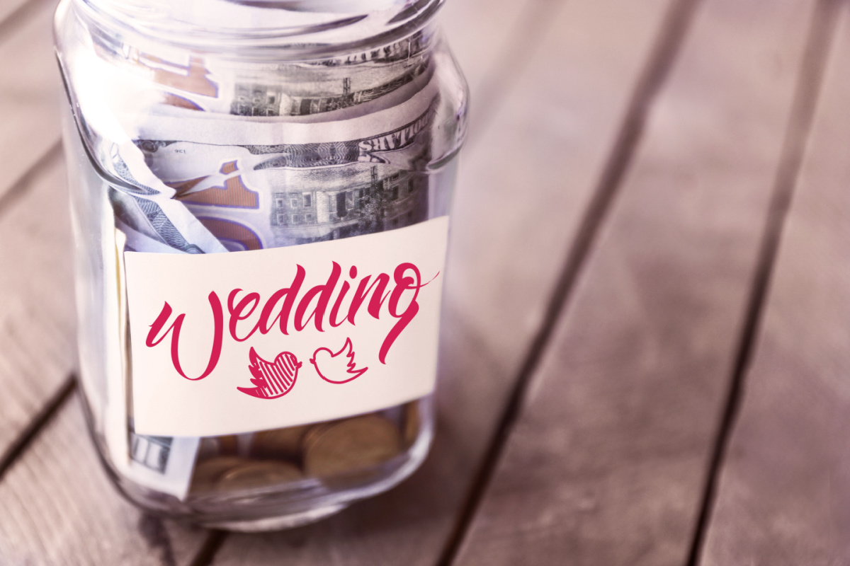 Wedding savings jar full of $100 bills