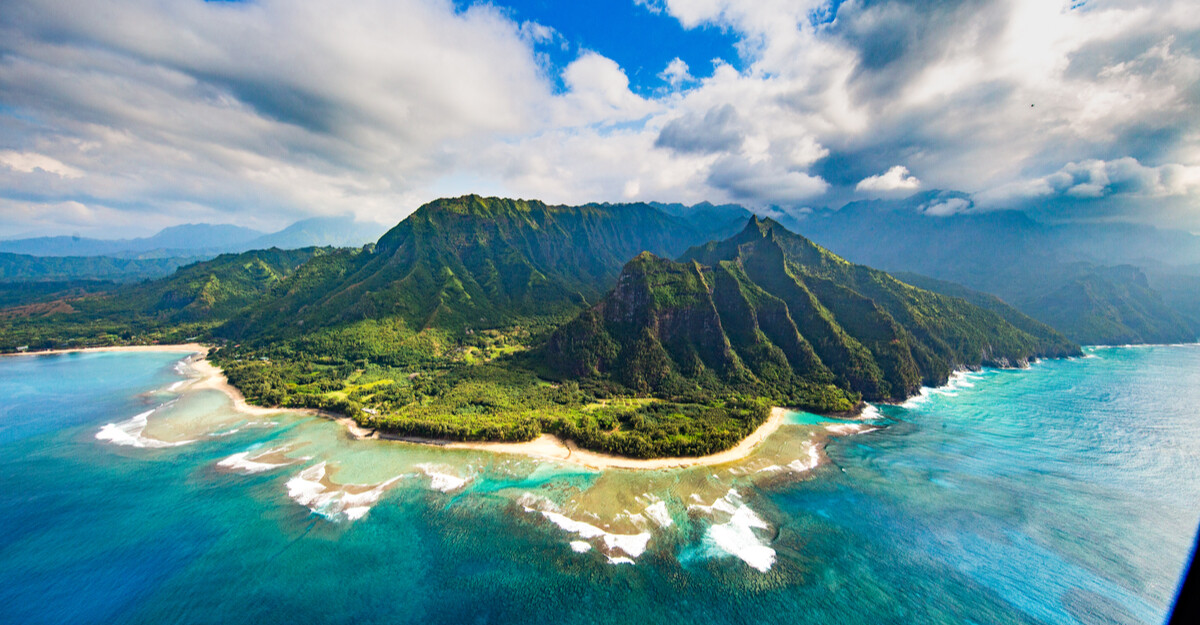 Overhead view of mountain range and ocean in Hawaii.