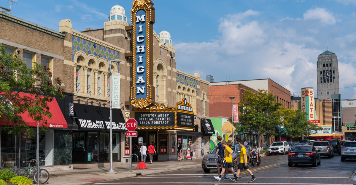 Street view of cars and theater in Michigan.