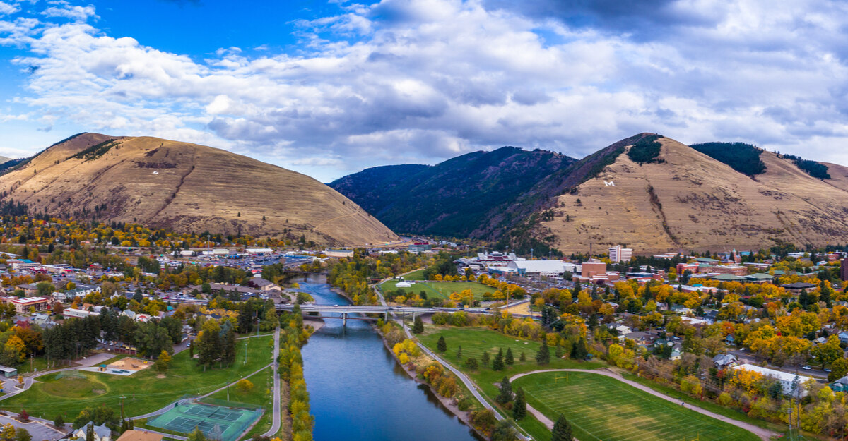 View of bridge, lake, and mountains in Montana.