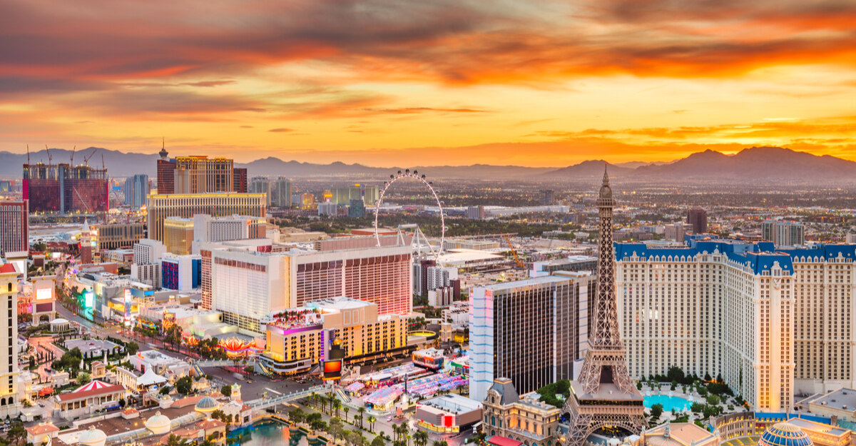 View of Las Vegas, Nevada Ferris wheel, hotels, and Eiffel Tower.