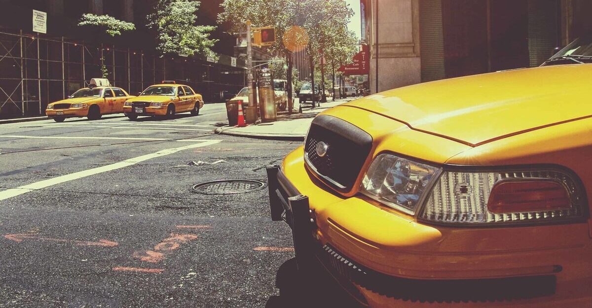 Cab pulling up to a crosswalk