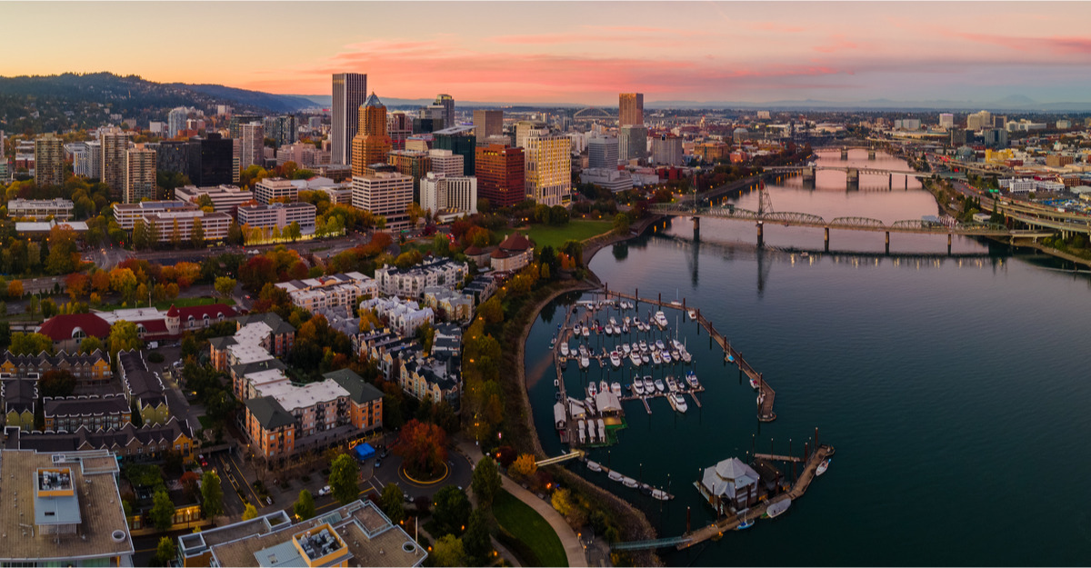 Overhead view of downtown buildings, harbor, and river in Oregon.