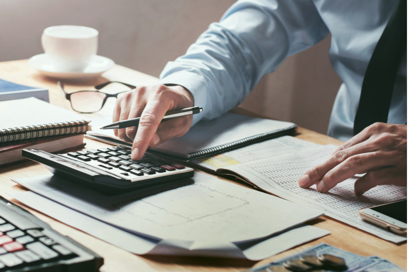 Man working on a spreadsheet.