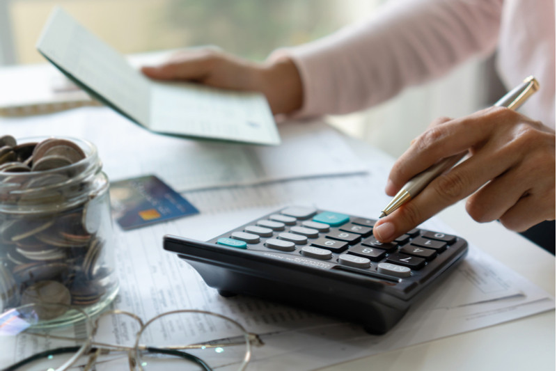 Man balancing his checkbook.