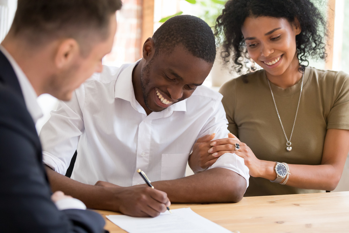 A man signing a loan agreement.